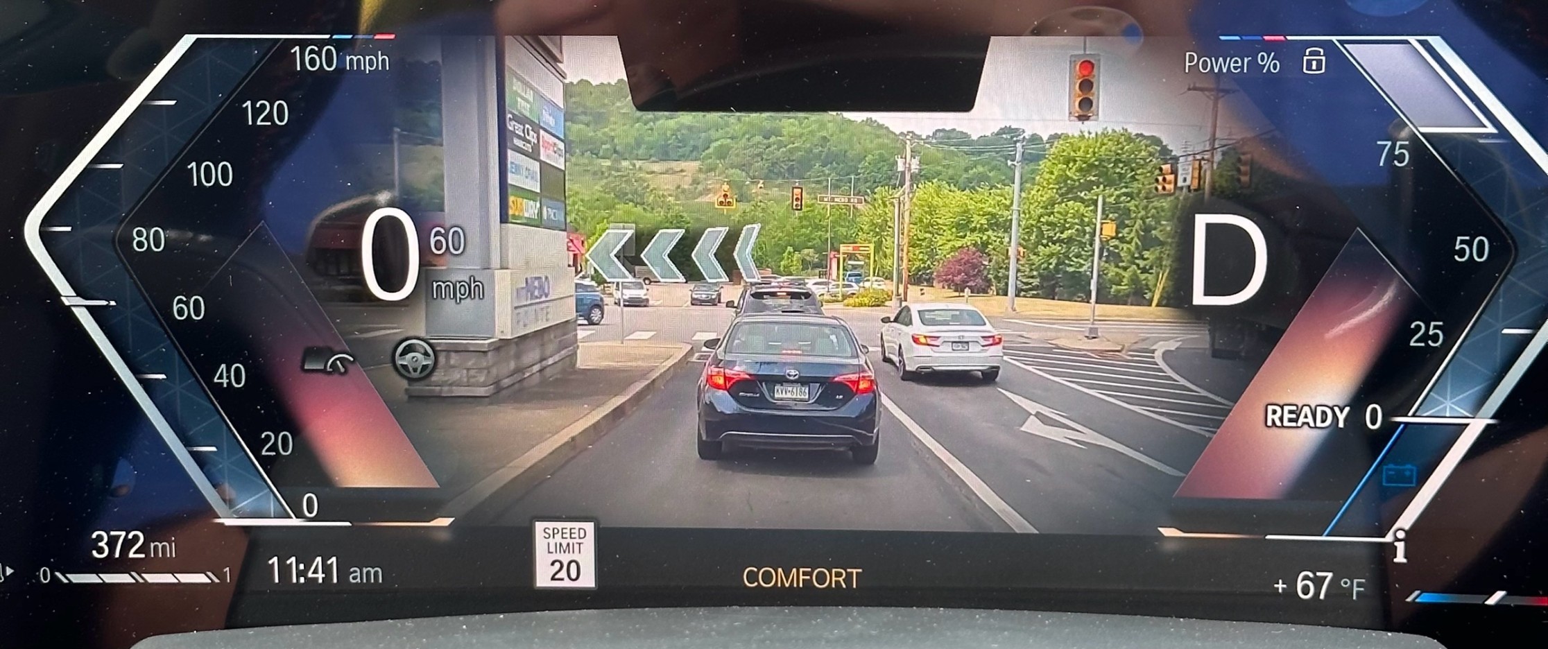 BMW Augmented View showing a large digital turn arrow overlaid on a live camera feed of the road ahead