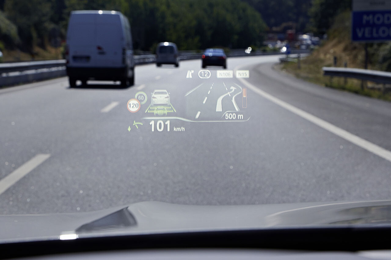 BMW heads-up display visible from the driver's seat, projecting subtle navigation information into the field of view